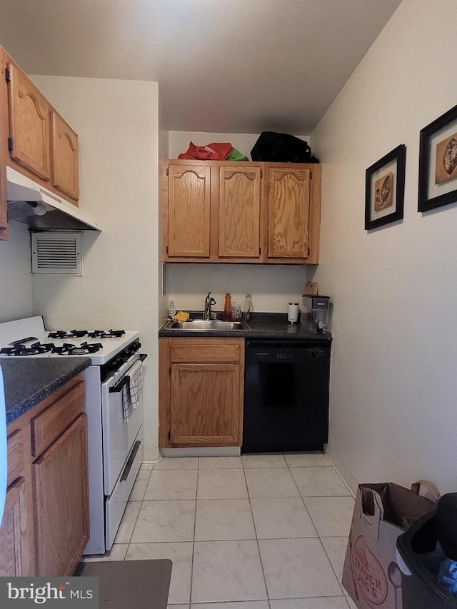 kitchen featuring gas range gas stove, dishwasher, light tile patterned floors, and sink