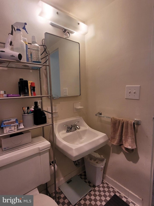 bathroom with toilet and sink