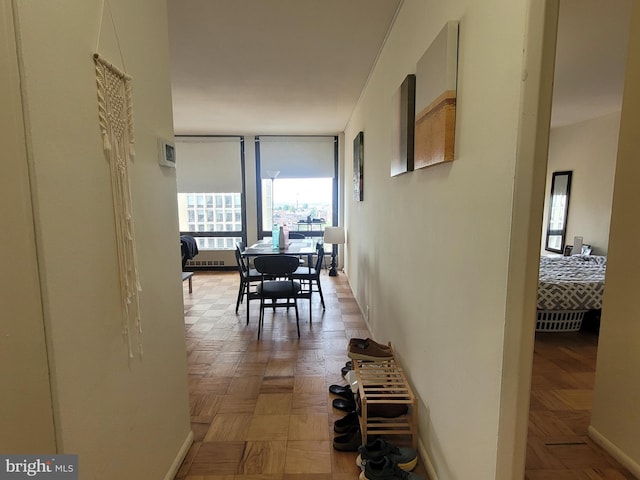 hallway featuring light parquet flooring