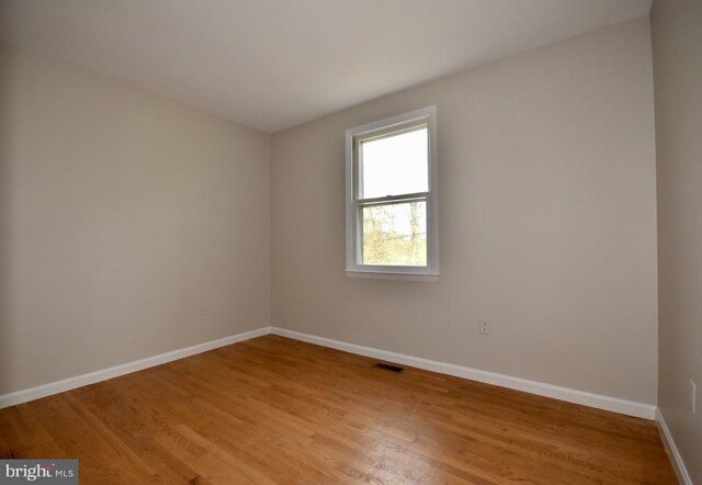 unfurnished room featuring light wood-type flooring