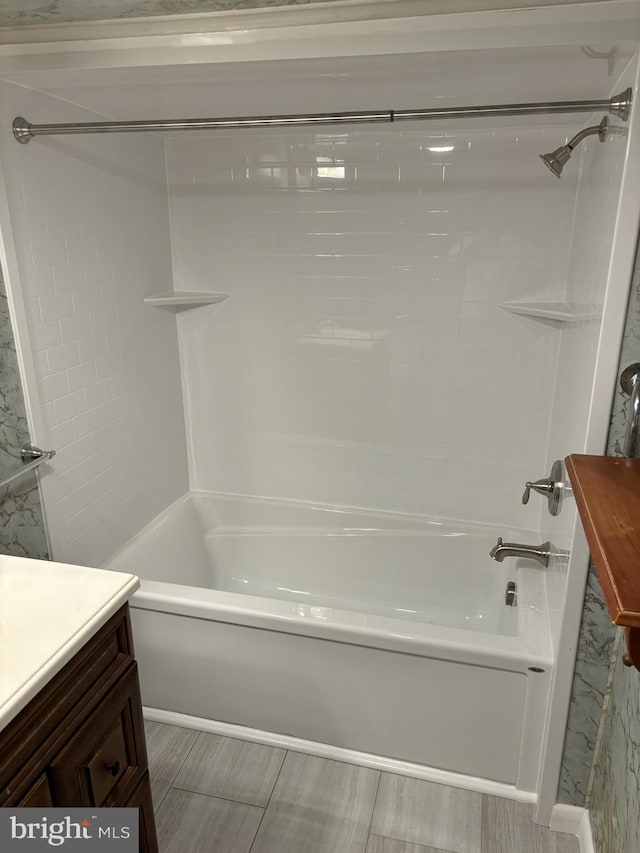 bathroom featuring vanity and bathtub / shower combination