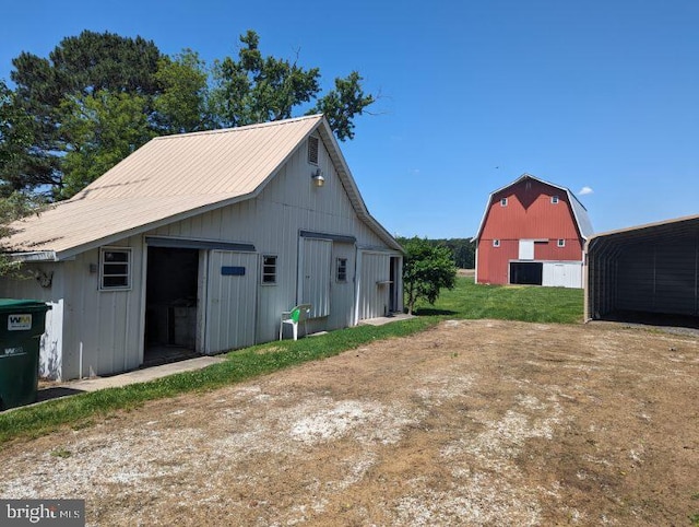 view of barn with a lawn