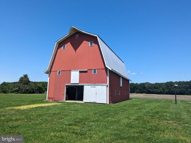 view of property exterior featuring an outdoor structure and a yard