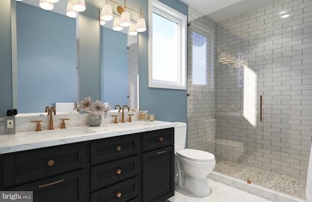 bathroom with tiled shower, vanity, and toilet