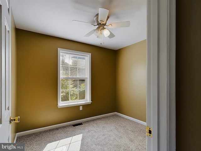 unfurnished room with light carpet and ceiling fan