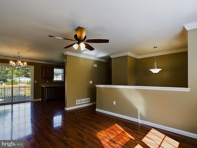 unfurnished room featuring dark wood-type flooring, ceiling fan with notable chandelier, and ornamental molding