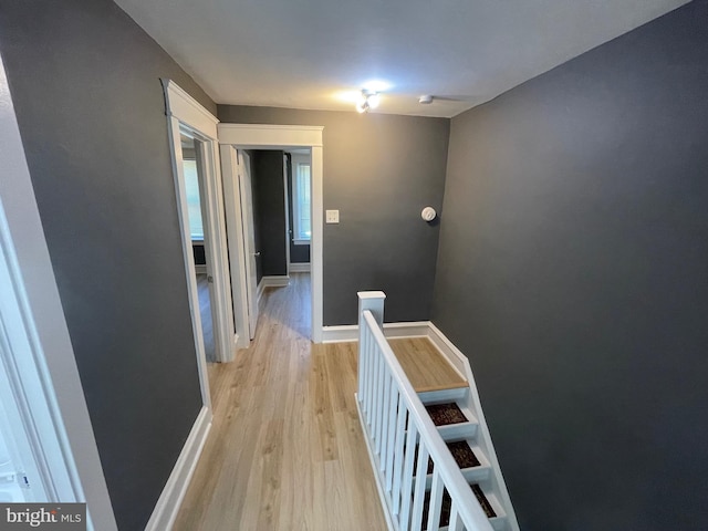 corridor with light wood-type flooring