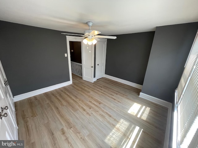 interior space with ceiling fan and light hardwood / wood-style floors