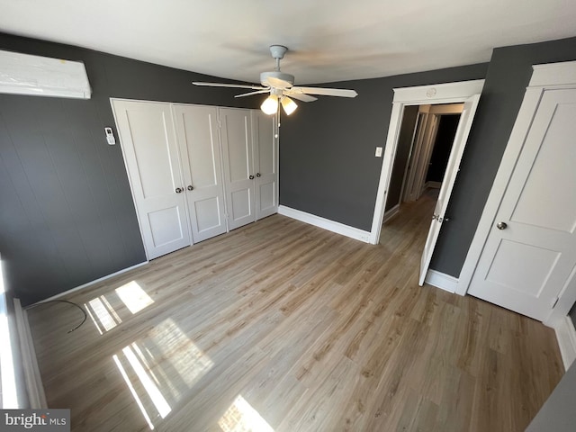 unfurnished bedroom featuring ceiling fan and light hardwood / wood-style flooring