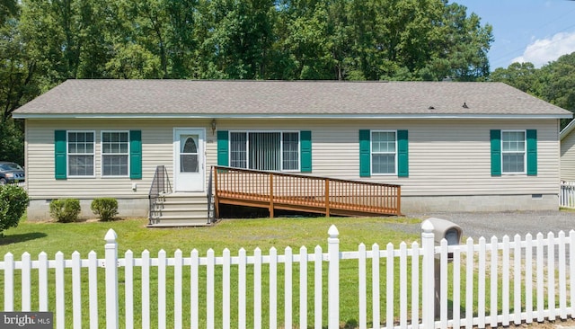 view of front facade with a deck and a front lawn