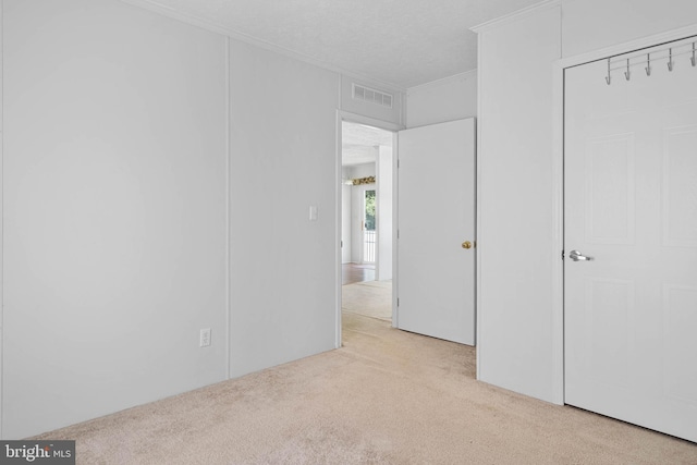 unfurnished bedroom featuring light colored carpet