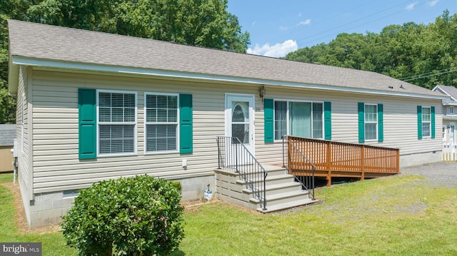 view of front of house featuring a deck and a front yard