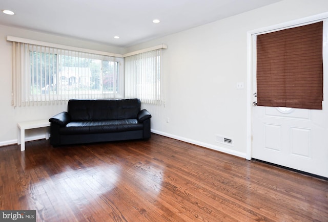 living area with dark hardwood / wood-style floors