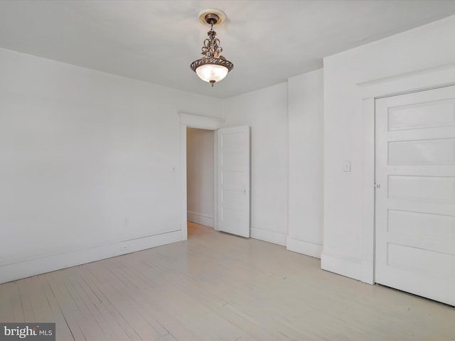 spare room featuring light wood-type flooring