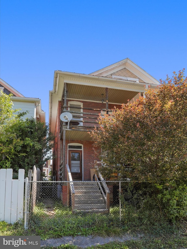 entrance to property featuring a balcony