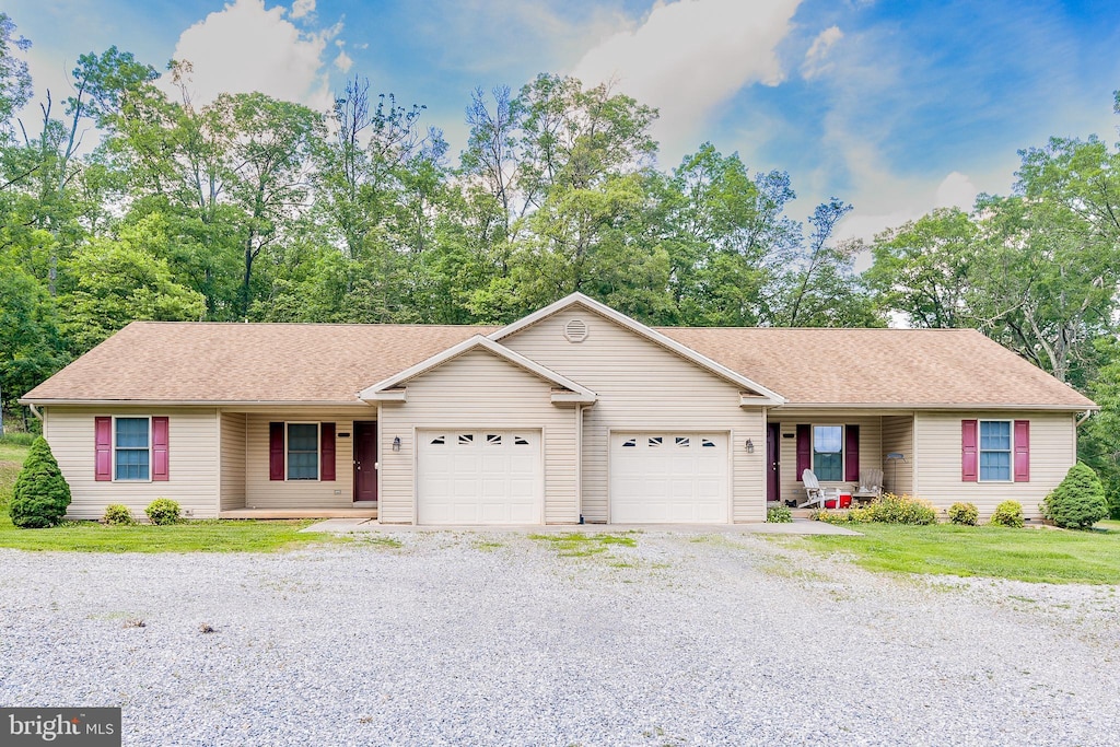 single story home with a garage