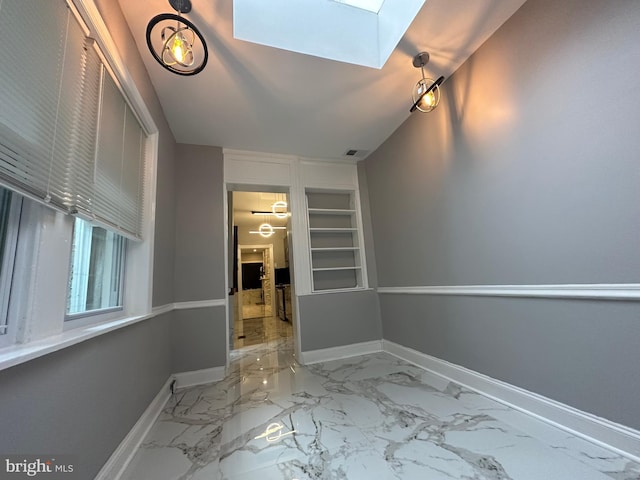 interior space with lofted ceiling with skylight