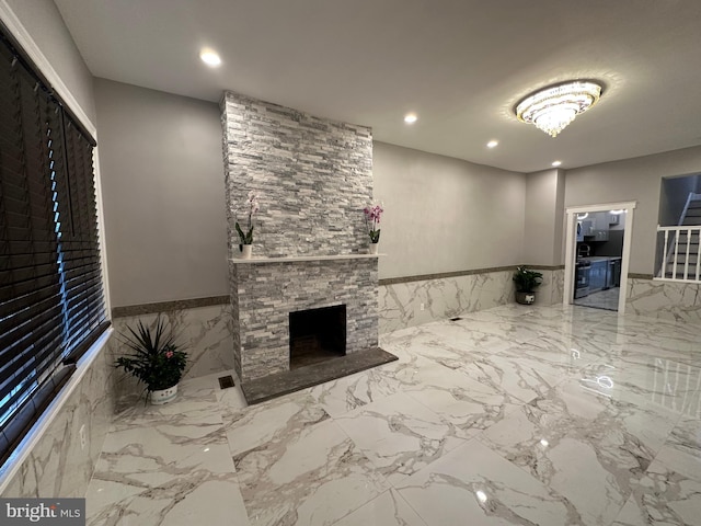 interior space featuring a fireplace and tile walls