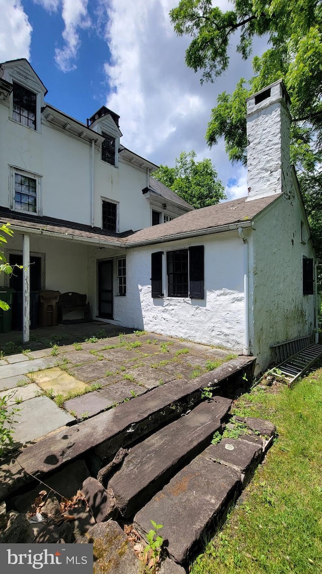 rear view of house featuring a patio