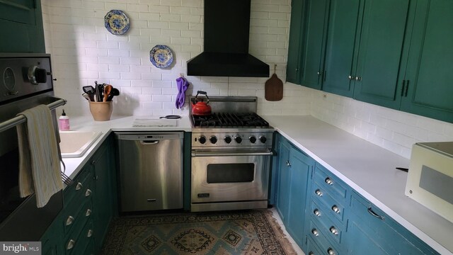 kitchen with stainless steel appliances, backsplash, and custom exhaust hood