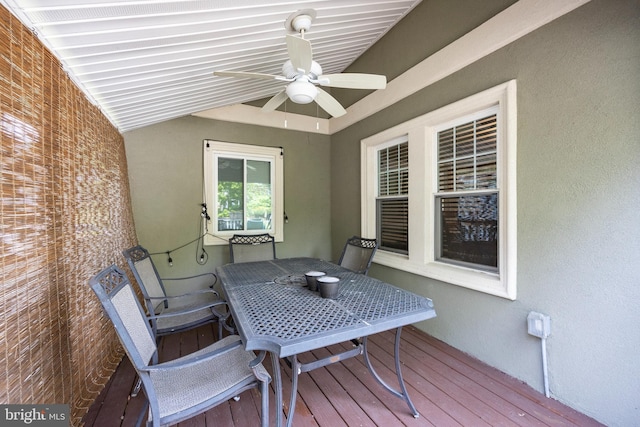 wooden deck featuring ceiling fan