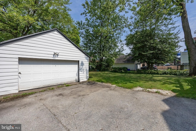 garage featuring a lawn