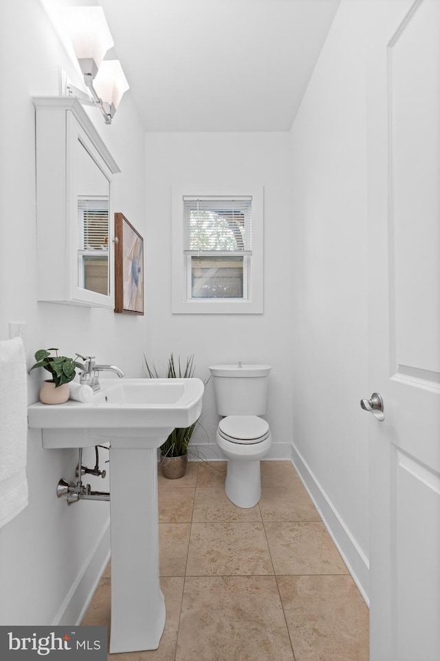 bathroom featuring tile patterned floors and toilet