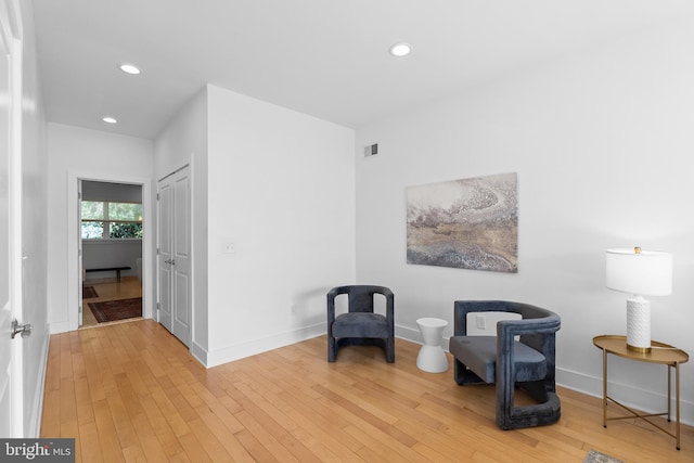 sitting room featuring hardwood / wood-style floors