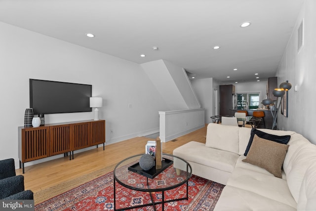 living room with light hardwood / wood-style flooring