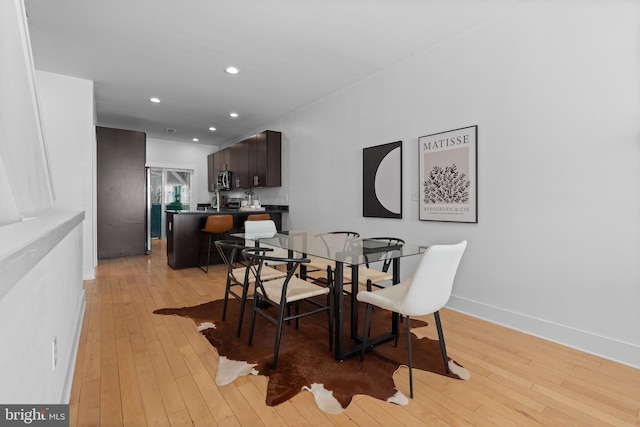 dining area with light hardwood / wood-style flooring