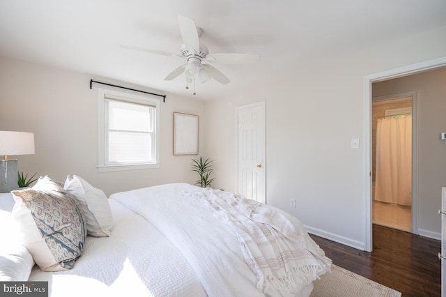 bedroom with ceiling fan and dark wood-type flooring