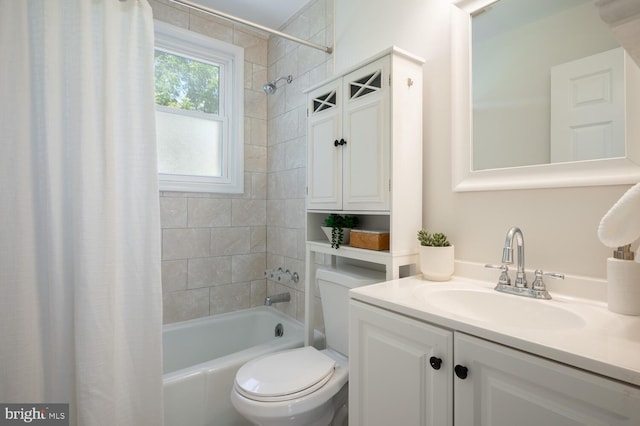 full bathroom featuring shower / bath combination with curtain, toilet, and vanity