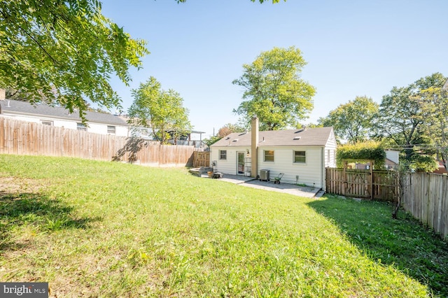 view of yard with a patio area and central AC unit