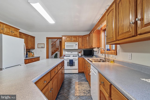 kitchen with white appliances and sink