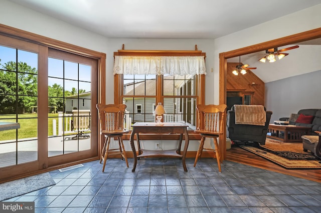 interior space featuring vaulted ceiling, ceiling fan, and a healthy amount of sunlight