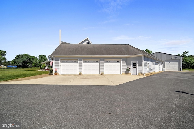 garage featuring a yard