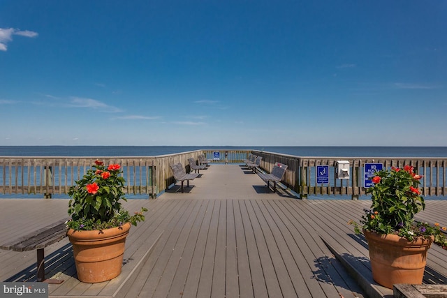 wooden deck featuring a water view