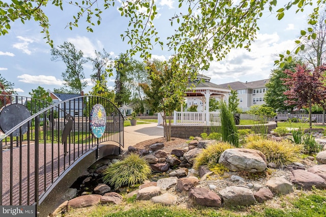 view of community featuring a gazebo and fence