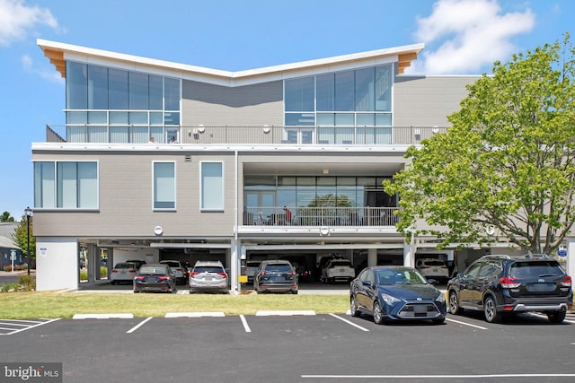 view of property featuring uncovered parking