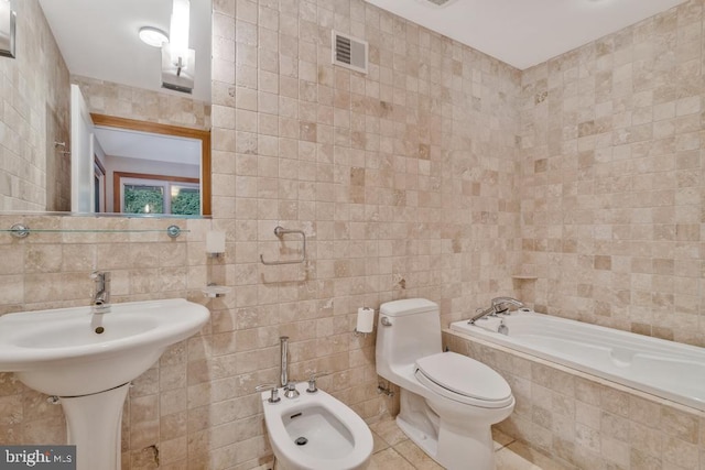 full bathroom with tiled bath, visible vents, a bidet, and tile walls