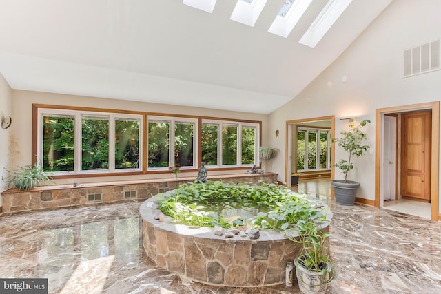 sunroom with lofted ceiling and visible vents