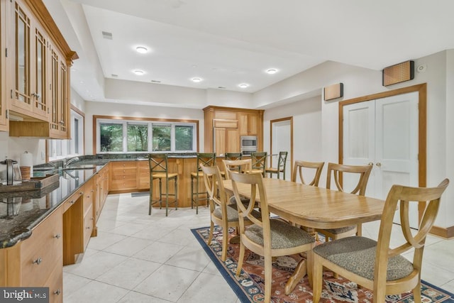 dining area featuring light tile patterned flooring