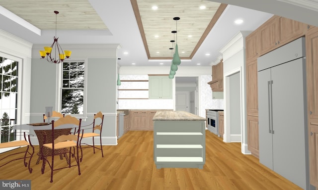 kitchen with light wood-type flooring, a center island, a raised ceiling, and hanging light fixtures