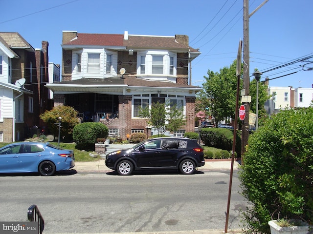 view of front of home featuring brick siding