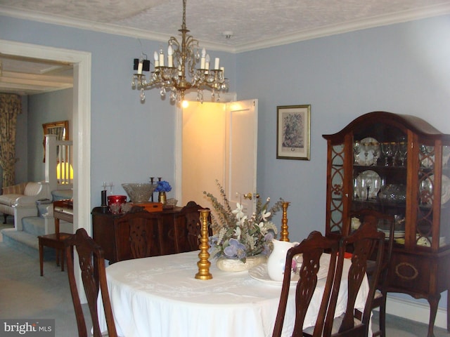 carpeted dining area featuring a notable chandelier, crown molding, and a textured ceiling