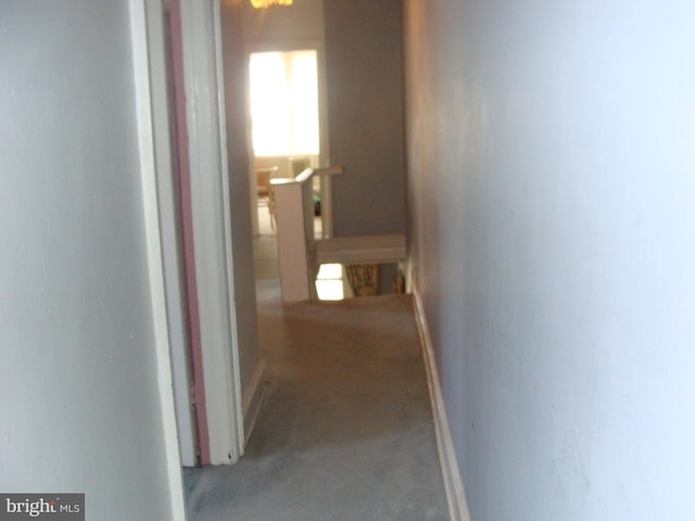 corridor featuring an upstairs landing