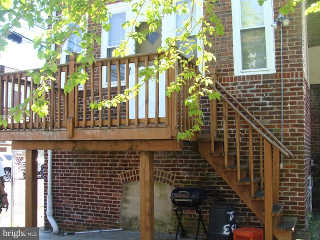 exterior space with stairs and area for grilling