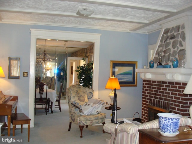 living area featuring an inviting chandelier, a fireplace, carpet, and ornamental molding