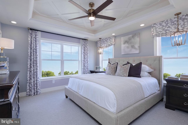 bedroom featuring coffered ceiling, light colored carpet, and ceiling fan with notable chandelier