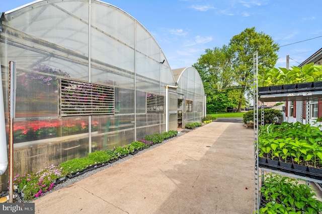 view of side of property featuring an outbuilding